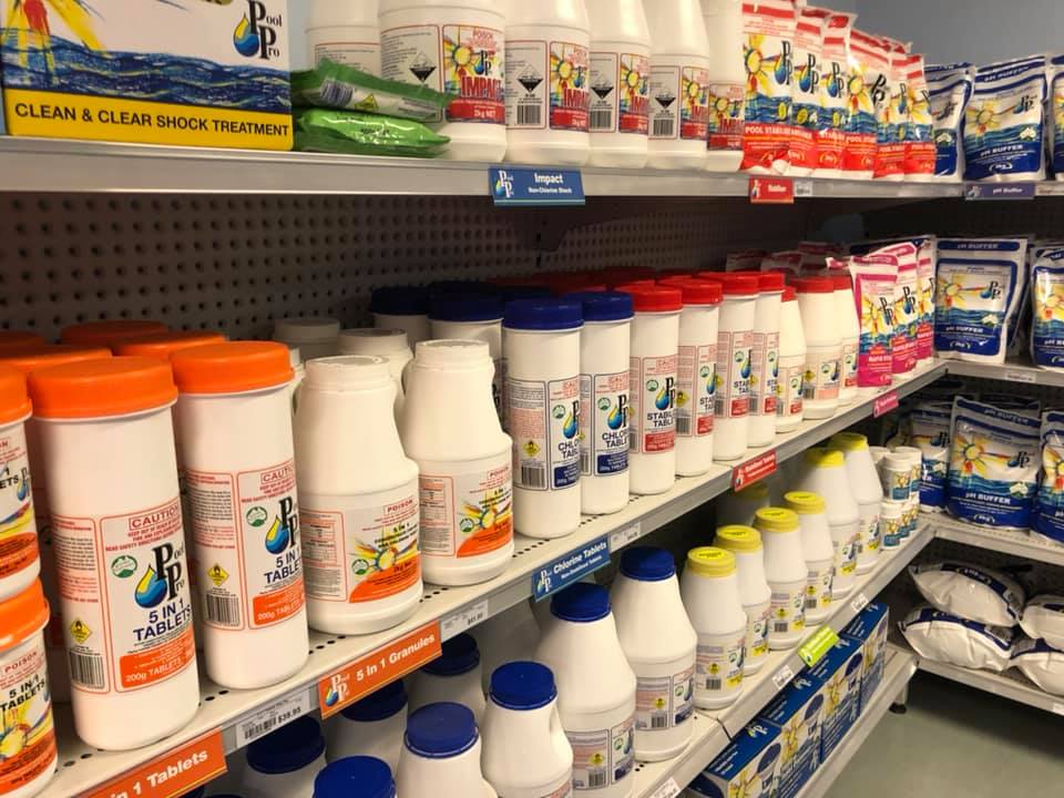 Shelves of Pool Pro chlorine tablets and pool chemicals inside the Highfields shop