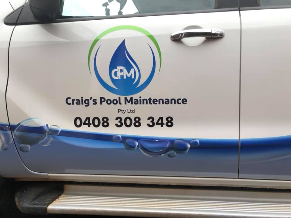 Close up of the CPM roundel and Craig’s Pool Maintenance wordmark on the van door